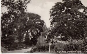 High Road, Stanford Rivers, with the White Bear Public House.