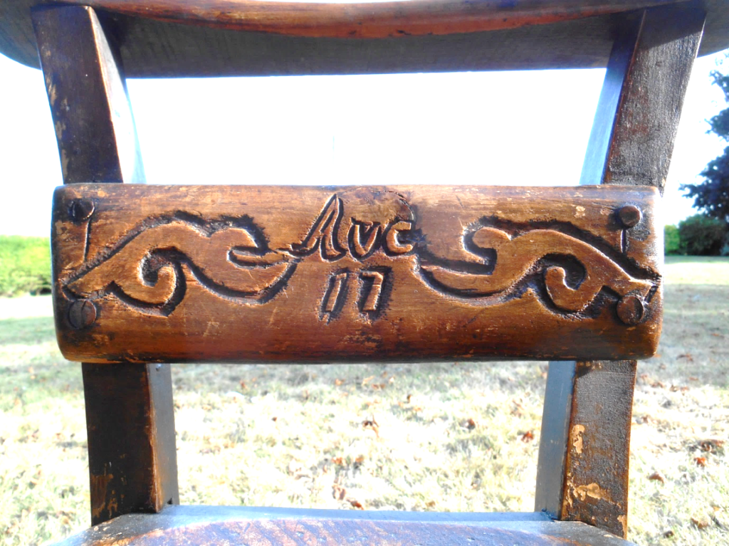 Along the top rail, in Gothic script, is written:
Saved From The Raid.