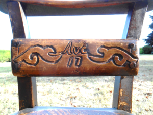 Along the top rail, in Gothic script, is written:
Saved From The Raid.