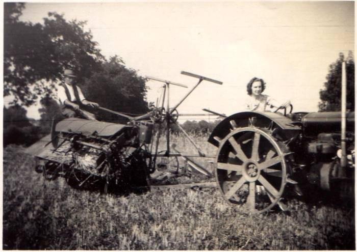 John Padfield on the binder with Doris driving the tractor in 1940