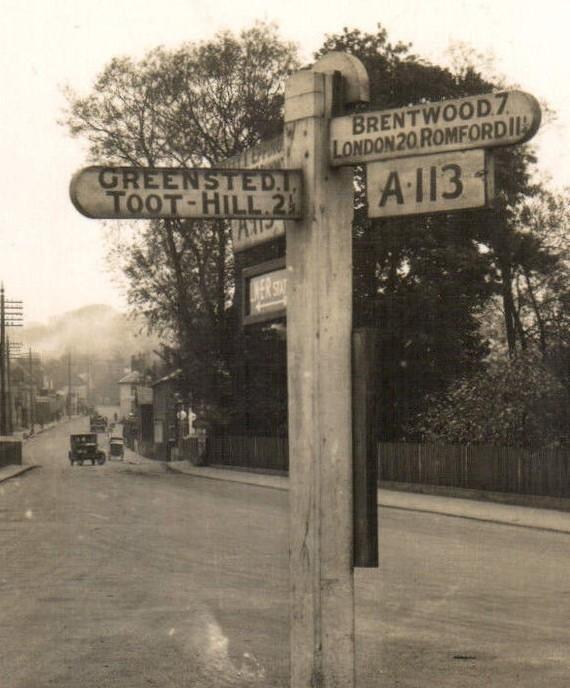 Signpost at the junction of Greensted Road and High Street, Ongar