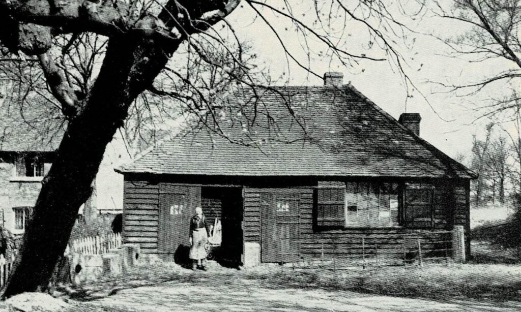 The smithy in 1953, with part of the blacksmith’s house in the background